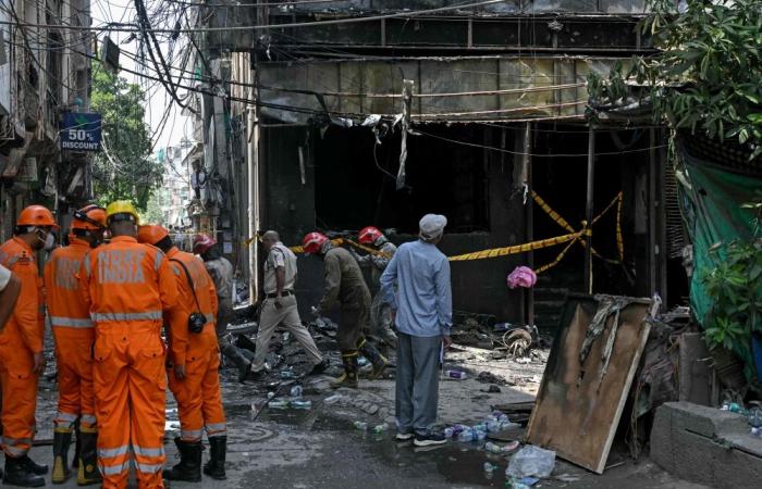 India detains hotel owner as probe begins into fire that left 21 dead amid scrutiny of safety standards