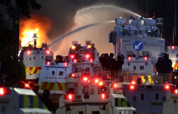Police deploy water cannon as Northern Ireland unrest enters second night after Belfast stabbing