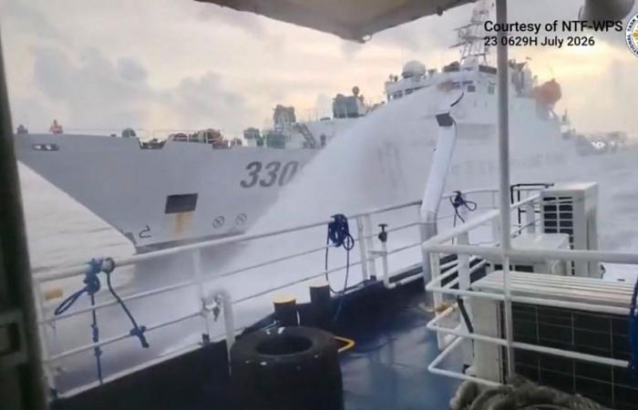 China fires water cannon at Philippine coast guard vessels near Scarborough Shoal