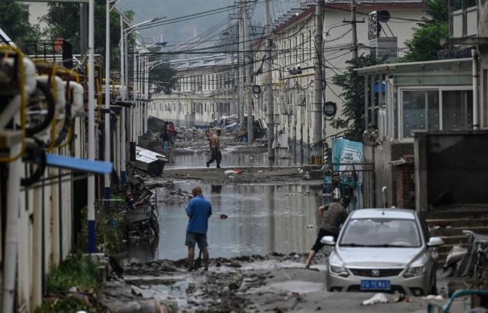 South China floods death toll jumps to 159 with 10 still missing