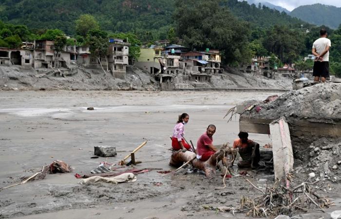 Swollen rivers, deep gorges and washed‑out roads hinder Nepal rescue effort as flood toll rises