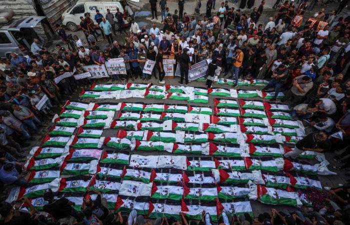 Gaza mourns 100 victims recovered from rubble in one of its largest funerals