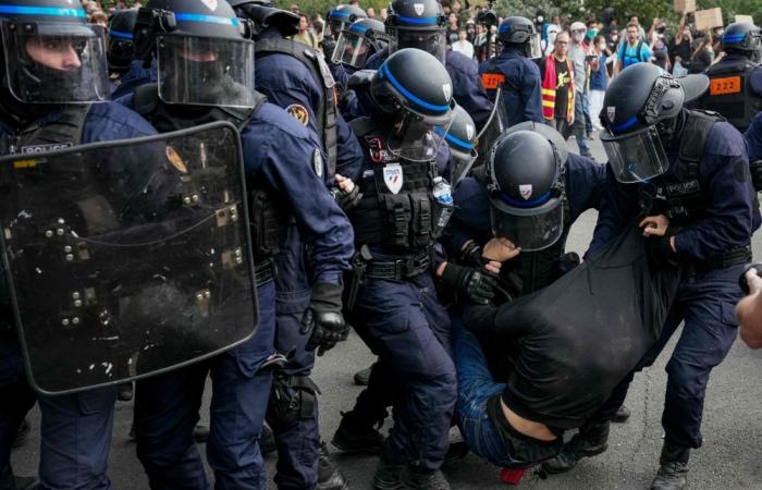 France suspends stun grenades at student protests after teen loses hand