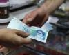 Iran rial slides to new low as coronavirus, sanctions weigh