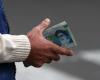 Iran rial slides to new low as coronavirus and sanctions weigh