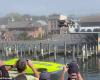 Stuntman Travis Pastrana jumps a rally car across a waterway in...