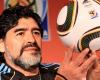 Funeral workers take photos with Maradona dead