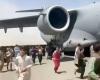 Panic at Kabul airport as Taliban promise 'open, inclusive Islamic government'