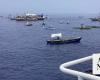 Filipino activists and fishermen sail in 100-boat flotilla to disputed shoal guarded by China