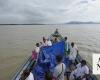 Indian mother delivers baby on boat as her river island is inundated by floodwaters