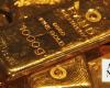 Gold slides over 2% as wider market rout spills over