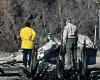 Mounted police comb fire-charred Los Angeles for bodies