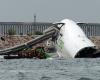 Cargo plane skids off runway into sea at Hong Kong airport, killing two in patrol vehicle, flights unaffected