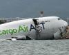 Cargo plane skids off runway into sea at Hong Kong airport; two killed, runway closed