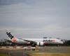 Jetstar plane forced to brake hard to avoid Qatar jet at Sydney airport, one crew member injured