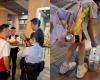 Parents arrested in Hong Kong after viral video shows 10-year-old carrying bags of beer